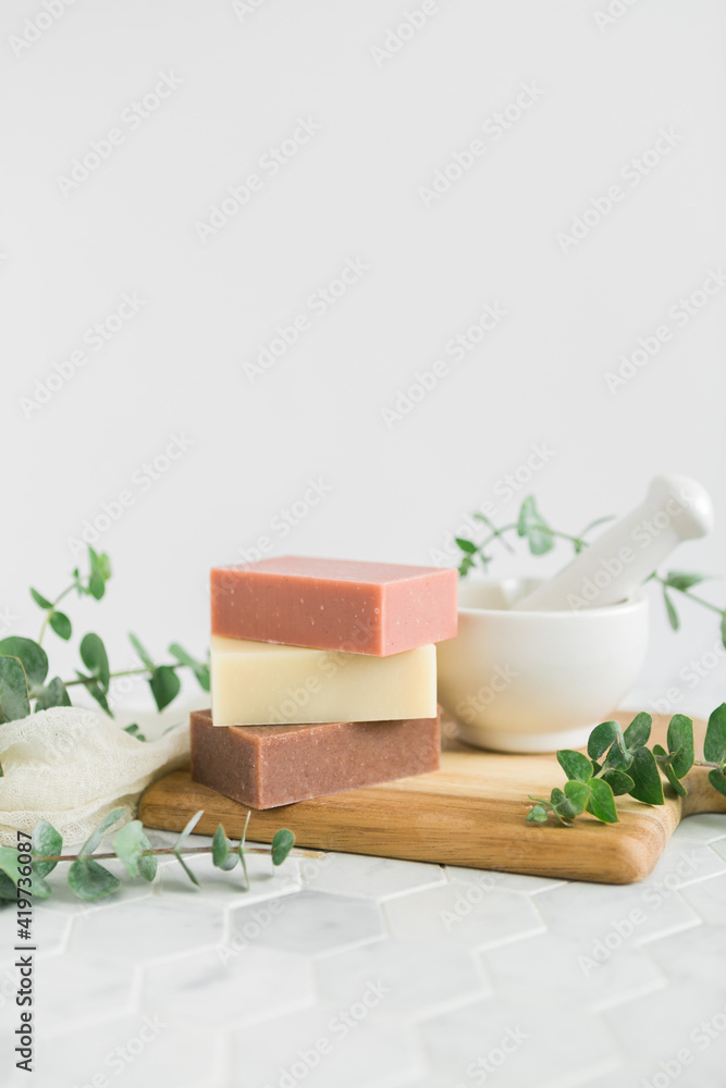Natural bars of homemade soap on white background