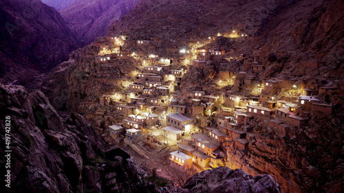 Village in canyon in western Iran photographed at dusk. photo