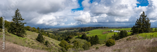 1x3 Panorama of Sonoma County, California, USA, with passing storm and clouds.