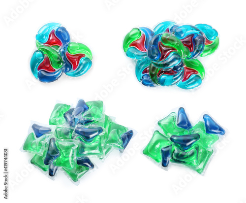 Set with laundry capsules on white background, top view. Detergent pods