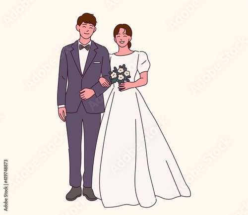 Fotografia The bride and groom in wedding dresses.
