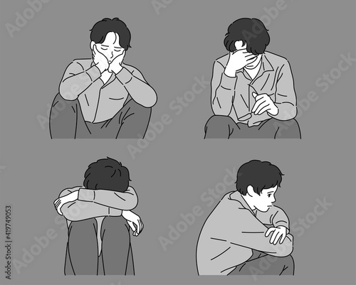 A man with a depressed expression is sitting.