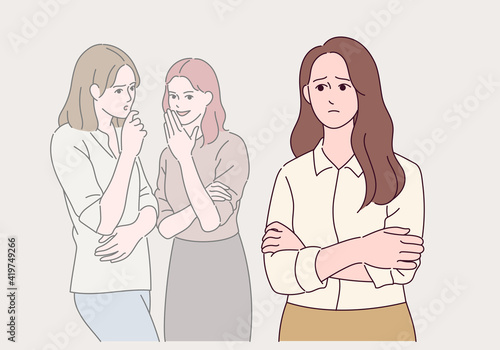 An office worker is whispering to a colleague.