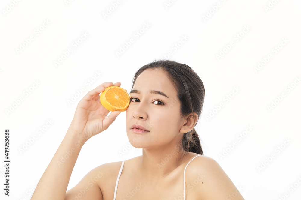 woman with sliced orange on white woman with sliced orange on white