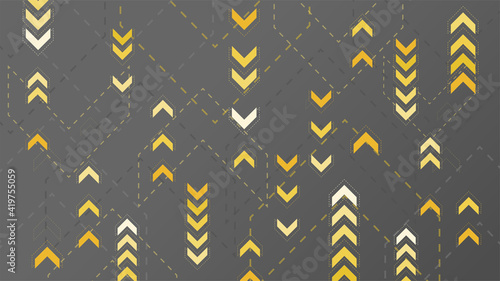 Abstract yellow arrows sign on dark background