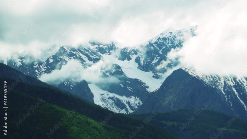 Clouds Overcast The Pennine Alps In Switzerland On A Sunny Day - Aerial Wide Shot Clouds Overcast The Pennine Alps In Switzerland On A Sunny Day - Aerial Wide Shot