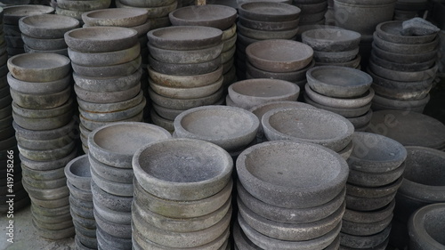 The group of Stone mortar without pestle for sale at local market in Indonesia