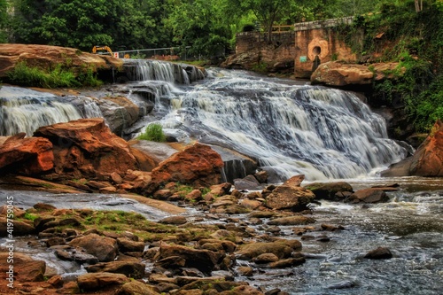 GREENWOOD, SC, UNITED STATES - September 20 2020: A large waterfall over a rocky cliff