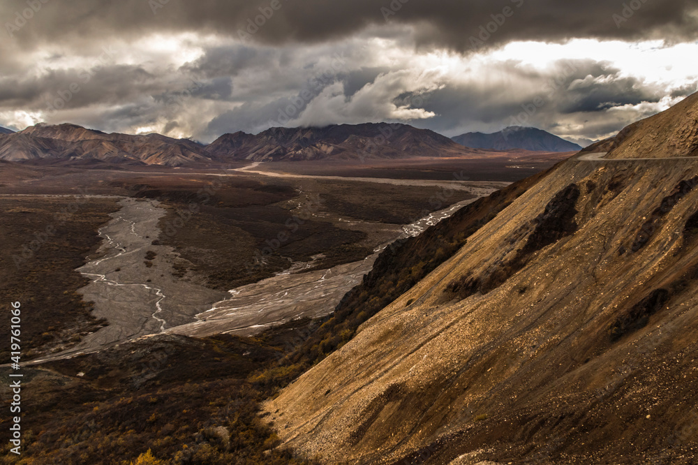 dramatic autumn landscape photo of he mountain peaks and valleys inside the Denali National Park in Alaska