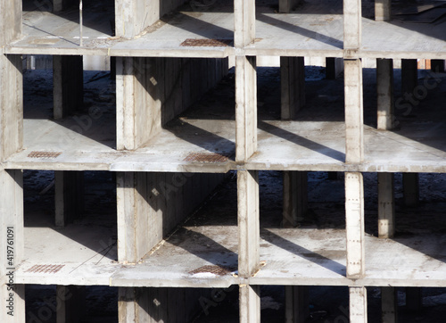 Background of a building under construction. Concrete frame of a building under construction.