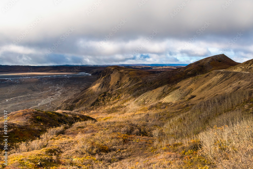 dramatic autumn landscape photo of he mountain peaks and valleys inside the Denali National Park in Alaska