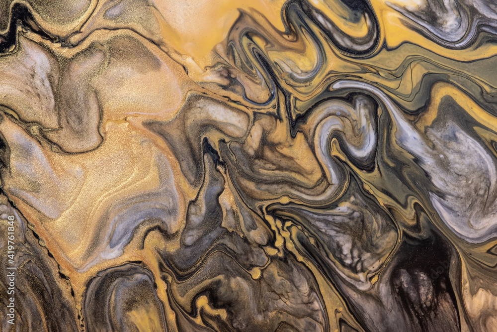Abstract fluid art background black and golden colors. Liquid acrylic painting