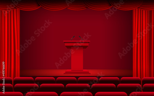 red announcement podium and red curtain on the stage