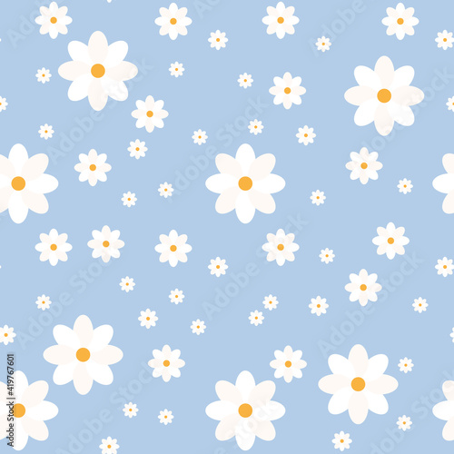 Seamless floral pattern. White chamomile or daisies on a blue background. Endless patterns for textiles and fabrics, wrapping paper, packaging. Vector image. Flat style