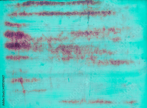 Multicolored background  rusty metal surface with blue paint flaking and cracking texture