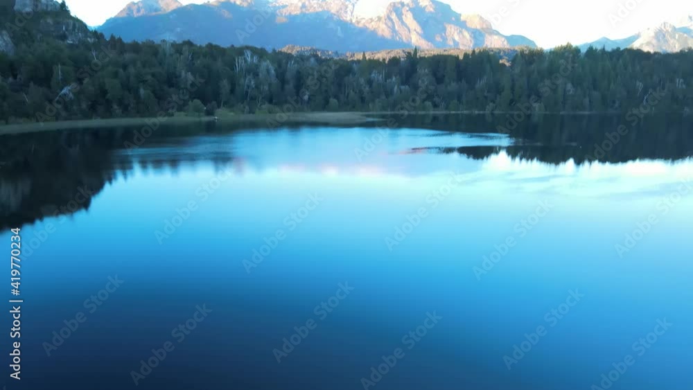 Gliding across the landscape of Lopes hill, over the Trebol lagoon, in Bariloche, Patagonia Argentina. Aerial footage. Gliding across the landscape of Lopes hill, over the Trebol lagoon, in Bariloche, Patagonia Argentina. Aerial footage.
