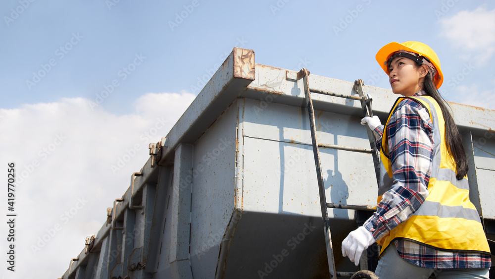 Portrait of a female train maintenance engineer.
