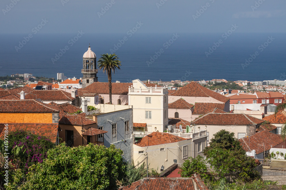 Spain - Canary/Tenerife - La Orotava - The nice aerial panorama view across the roofs and towers of Orotava to the blue ocean water