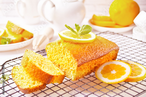 Pieces of fresh homemade baked sliced lemon cake on the baking rack photo