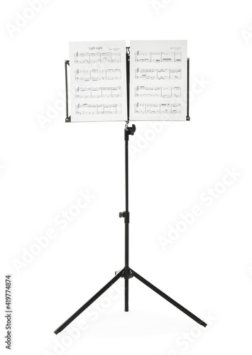 Note stand with music sheets on white background