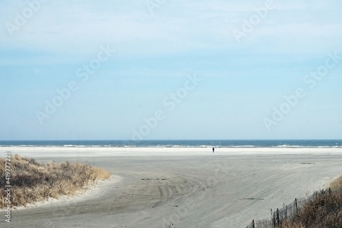 Dune Ocean Sand with Person  on Sunny Day