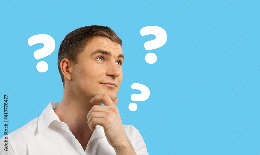 Question sign with a beautiful alarmed man on pastel background Question sign with a beautiful alarmed man on pastel background