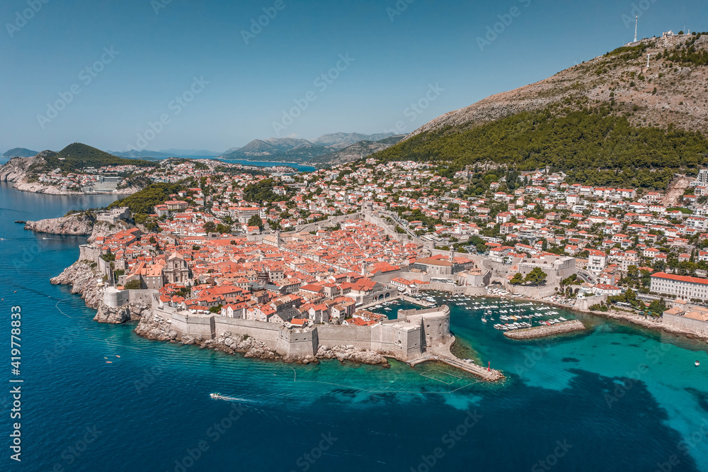 Aerial drone shot of Old Port in Dubrovnik old town in Croatia summer midday noon