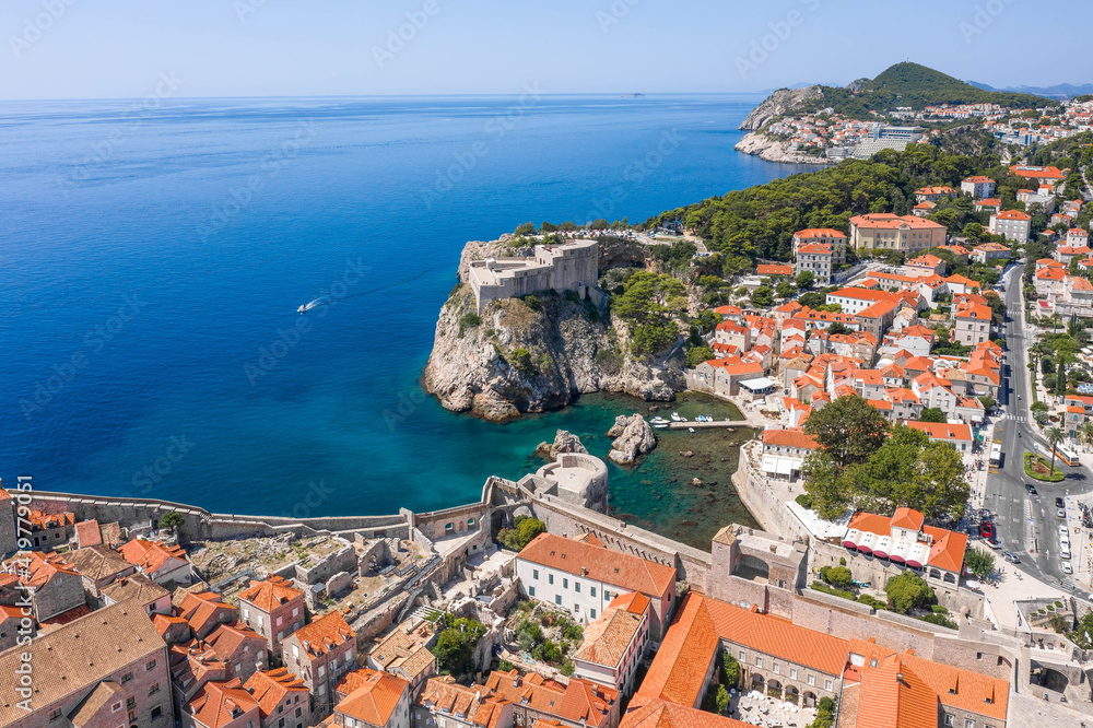 Aerial drone shot West Pier in Dubrovnik old town Fort Lovrijenac in Croatia summer