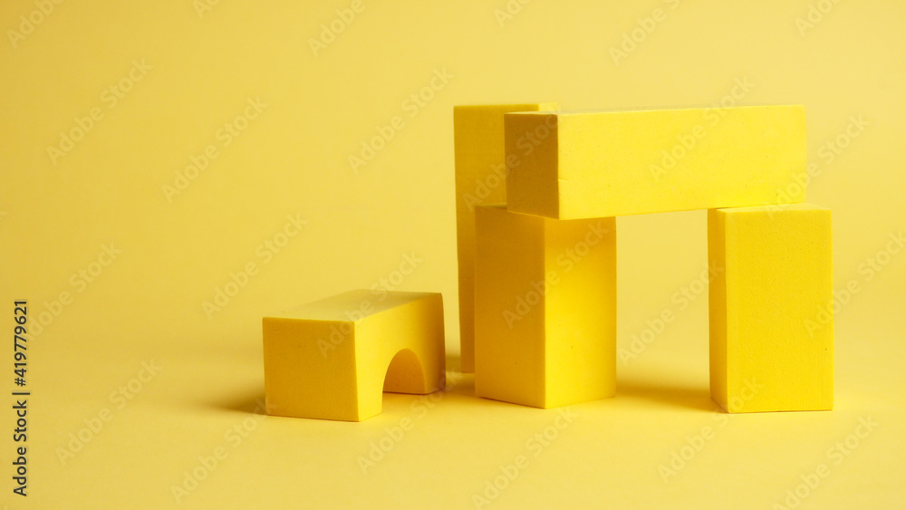 abstract squares on a yellow background with shadows, top view, geometric shapes for demonstration abstract squares on a yellow background with shadows, top view, geometric shapes for demonstration