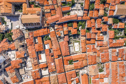 Aerial overhead drone shot of red brick Dubrovnik old town city wall in Croatia summer