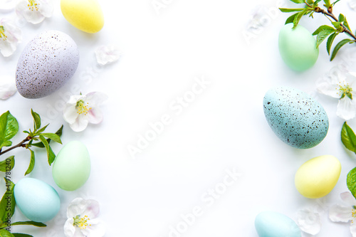 Colorful Easter eggs with spring blossom flowers
