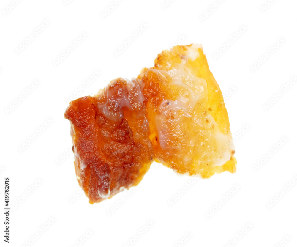 Fried lard cracklings on a white plate.