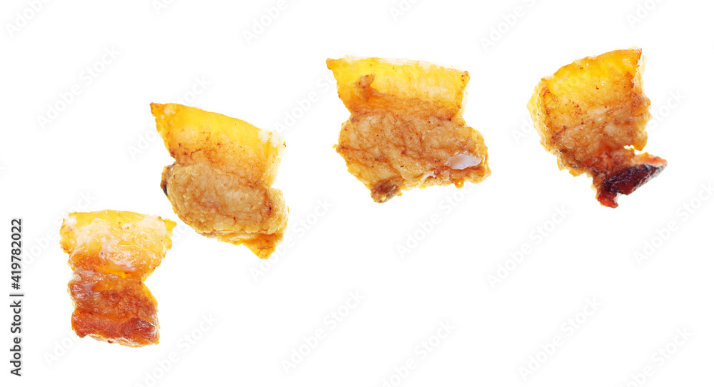 Naklejka premium Fried lard cracklings on a white plate.