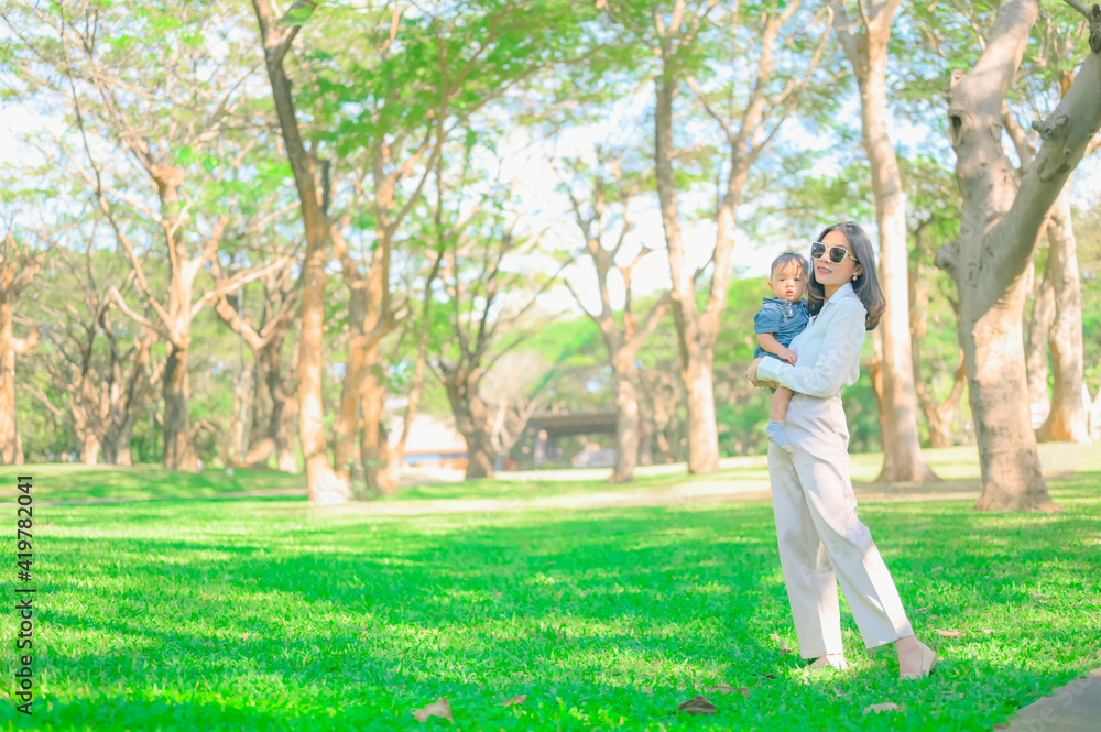 Mother And Baby outdoors. Nature.Portrait of happy loving mother Mother And Baby outdoors. Nature.Portrait of happy loving mother