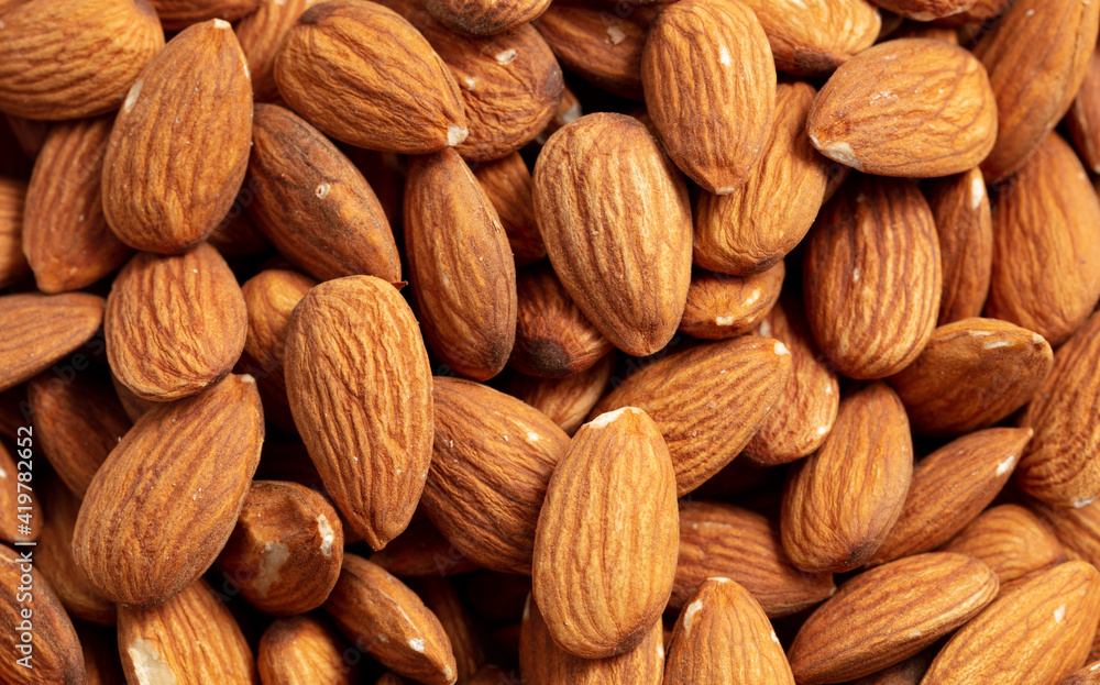 Close up of almond nuts as background. Close up of almond nuts as background.