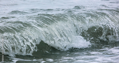 Wave in the sea with splashing water.