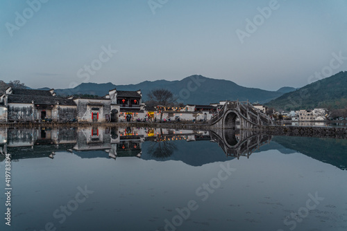 Sunset view of the ancient Chinese architecture in Hongcun village, Anhui province. photo