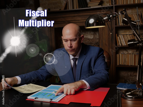 Fotografia Conceptual photo about Fiscal Multiplier Businessman, executive manager hand fil