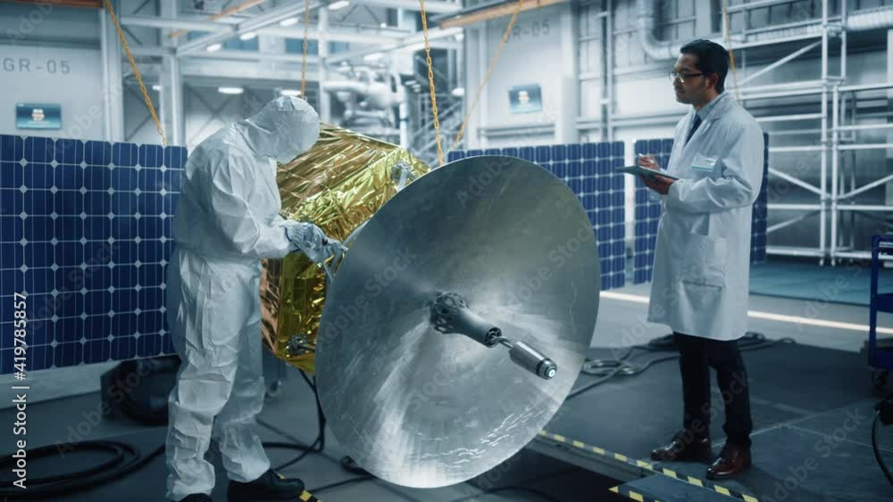 Engineer and Technician Working on Satellite Construction. Aerospace
