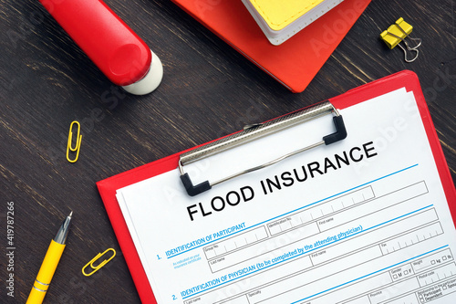 Conceptual photo about FLOOD INSURANCE Application Form with written phrase.