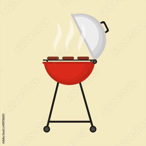 Red barbecue kettle grill. Metal BBQ grill.