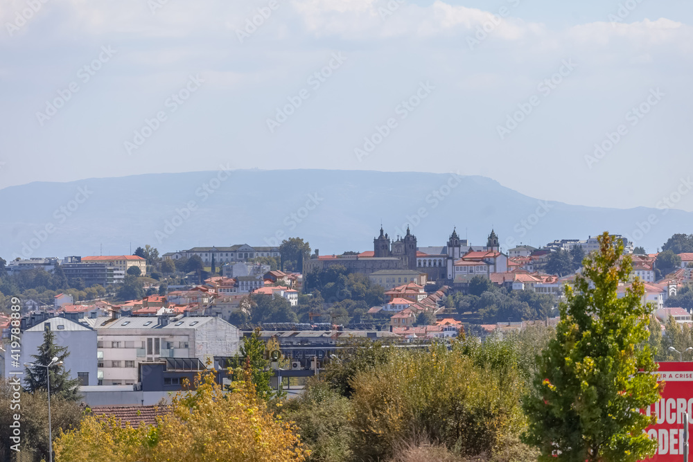 View at the Cathedral of Viseu and Church of Mercy on top, Se de Viseu e Igreja da Misericordia, monuments of various classical styles, with serra da estrela as background