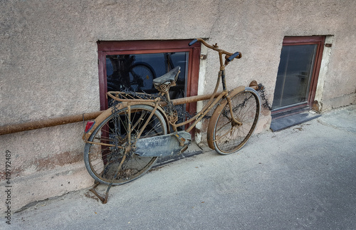 Old and Rusty Bike on the Street. Abandoned vehicle