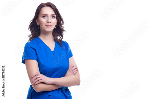 Positive Professional Female GP Doctor Posing in Blue Doctor's Smock On White Background. © danmorgan12