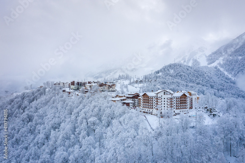 Winter aerial view of the Ski Resort Rosa Khutor. A complex of hotels on the site of the former Olympic village of Rosa Plateau at an altitude of 1170 m from sea level. Krasnaya Polyana, Sochi, Russia photo