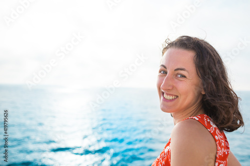 Portrait of a woman against the background of the sea.