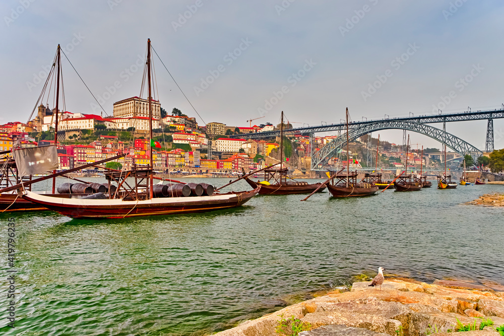 Portugal Destinations. Cityscape of Porto City in Portugal with Traditional Attraction Winery Boats in Foreground.