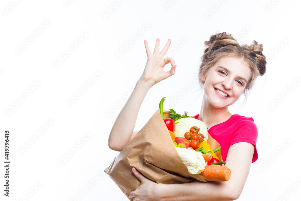 Healthy Eating and Lifestyle. Positive Caucasian Girl Posing With Eco Shopping Bag Filled With Vegetables Showing OK Sign. Horizontal Image Composition
