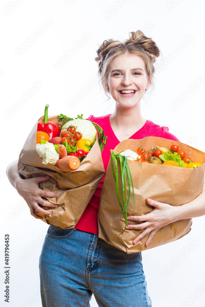 Healthy Eating and Lifestyle. Positive Caucasian Girl Posing With Eco Shopping Bag Filled With Vegetables. Vertical Image Orientation