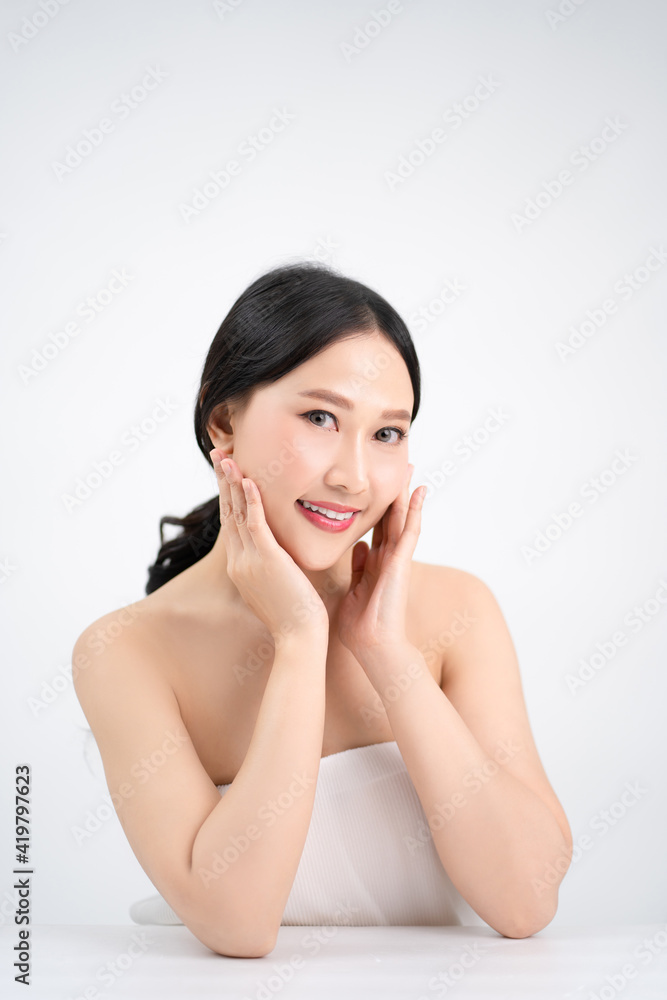 Beautiful young Asian woman have a bright and youthful face. She is happy and smiling. Beautiful young Asian woman have a bright and youthful face. She is happy and smiling.